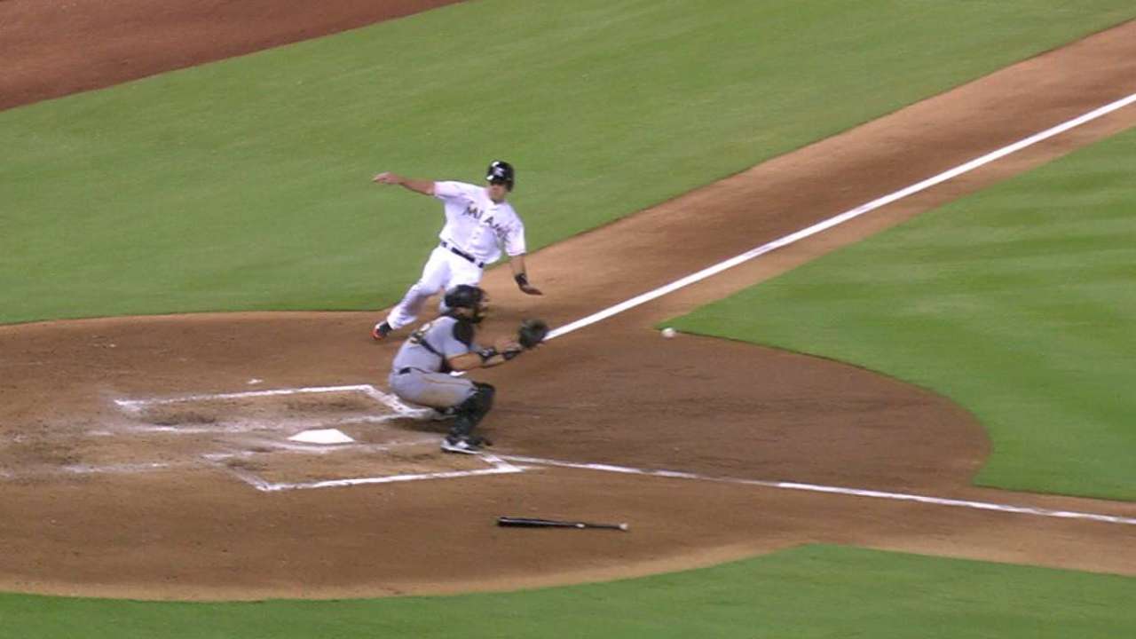 Realmuto beats tag at home