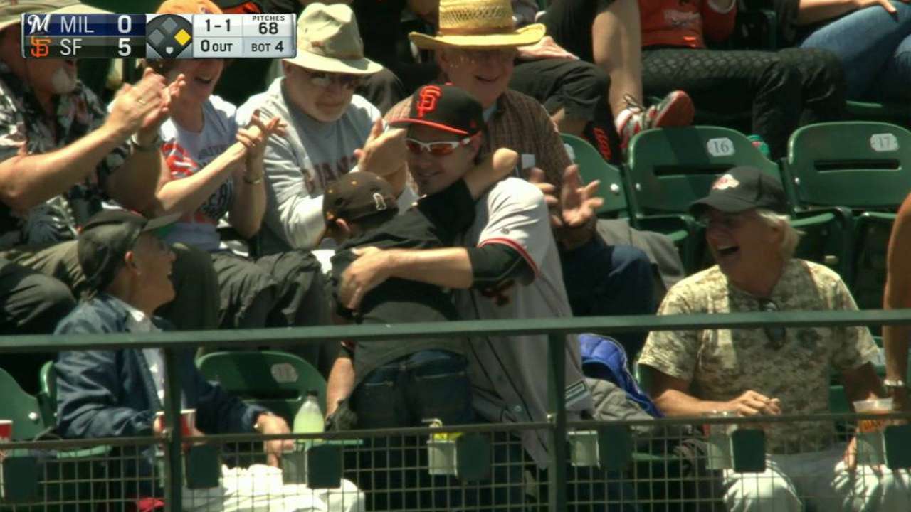 Young fan is given a foul ball