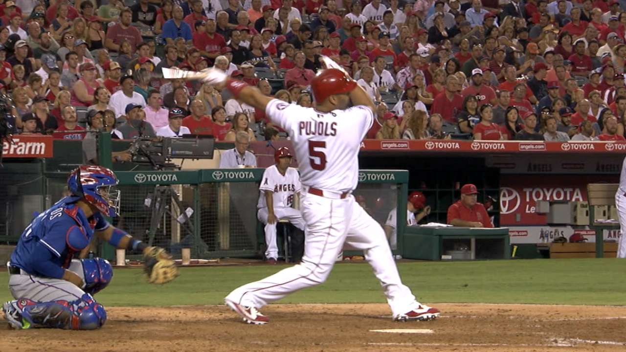 Pujols' two homers power Halos past Texas