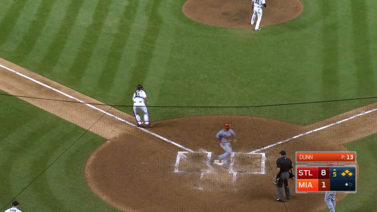 Cards leapfrog Fish despite Ichiro throw
