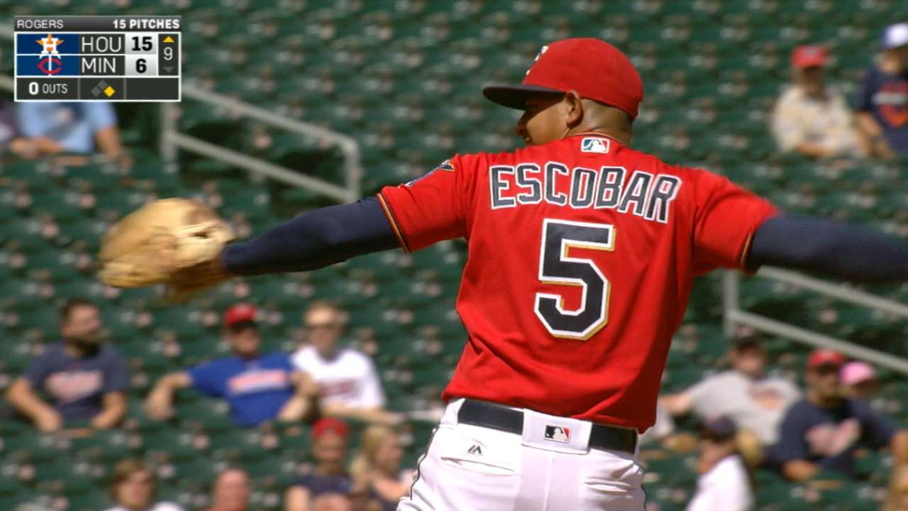 Infielder Escobar pitches in 9th