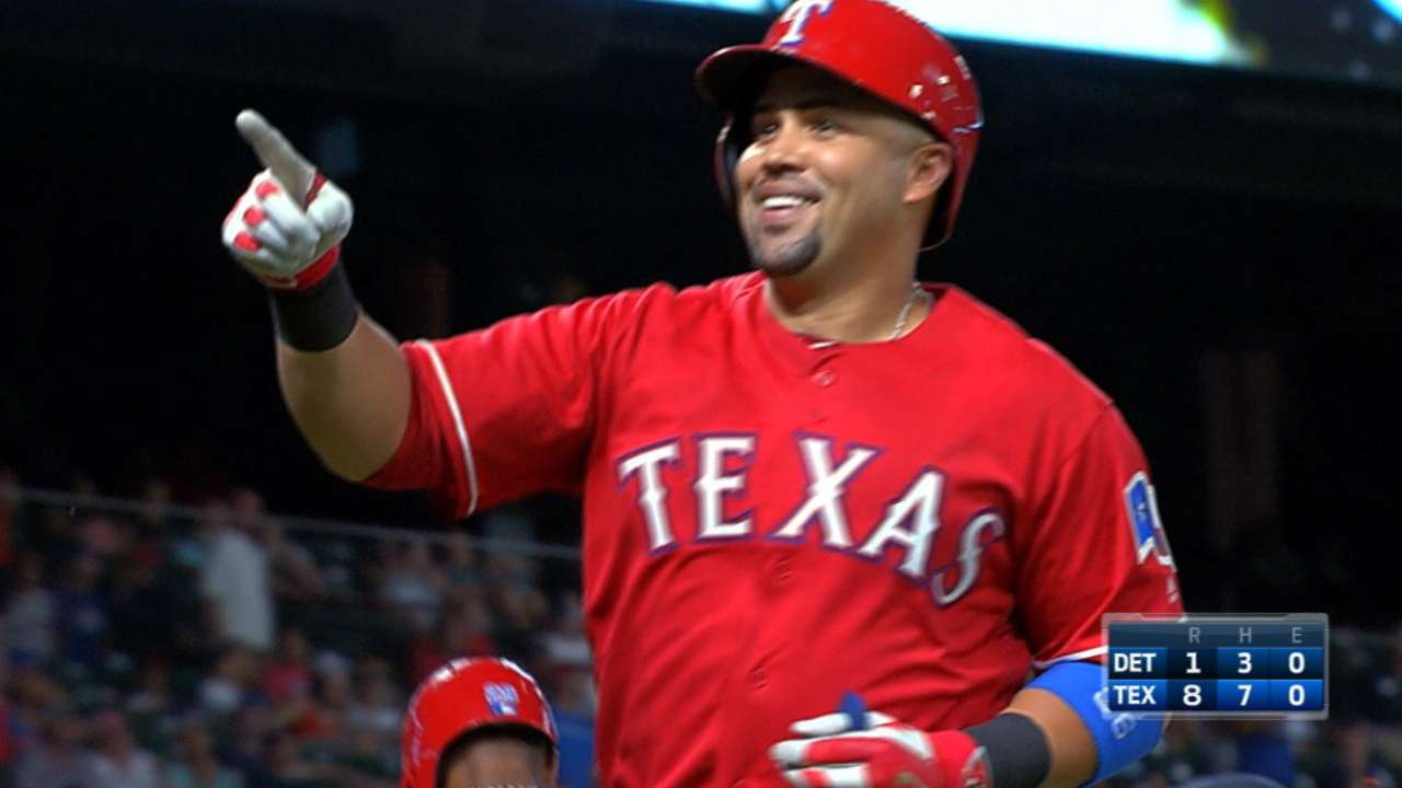 Rangers belt four homers in win
