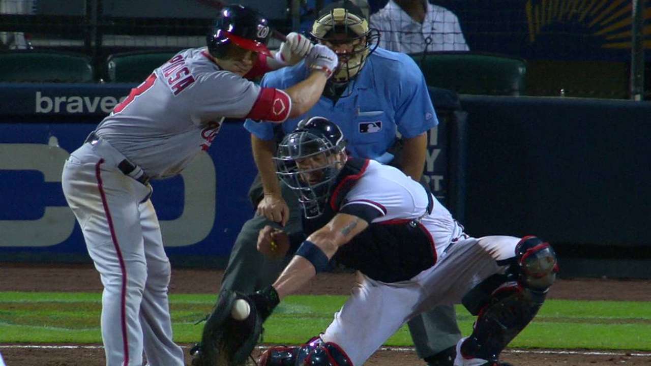 Espinosa dodges ball in dirt