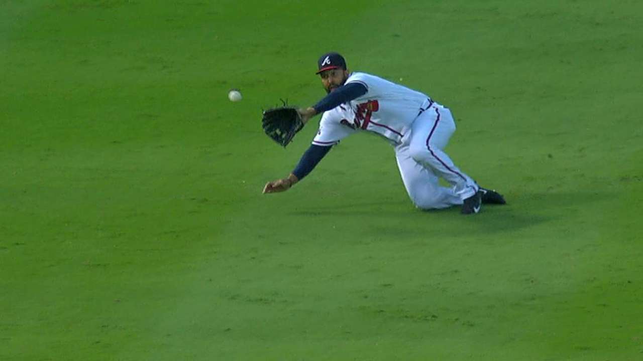 Kemp makes a sliding grab
