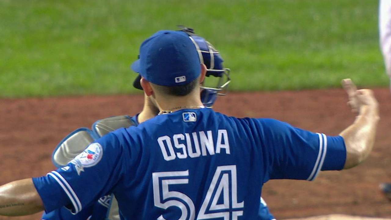Osuna shakes off balk to close out big win