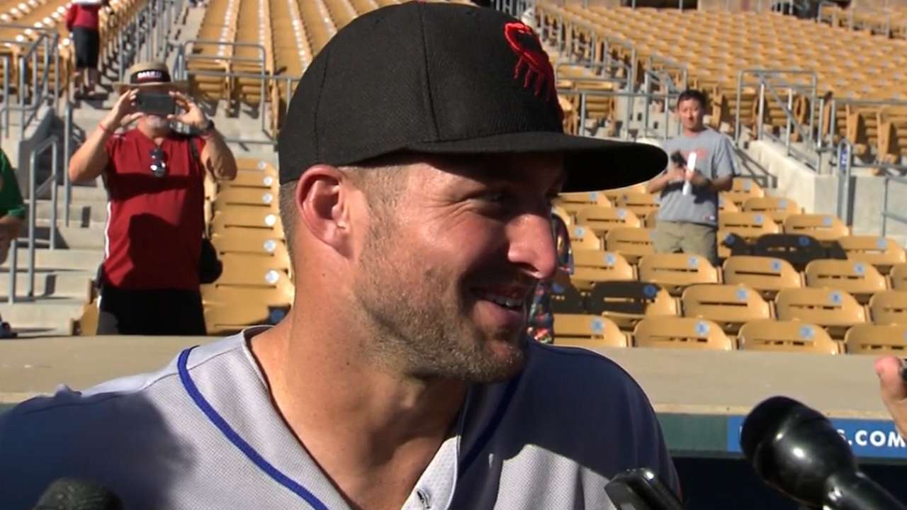 Tebow reflects, then records some firsts