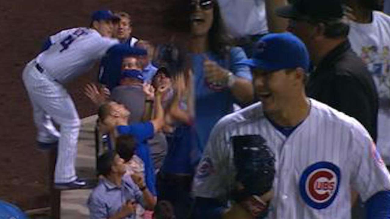 Top shelf: Rizzo scales wall to make foul grab