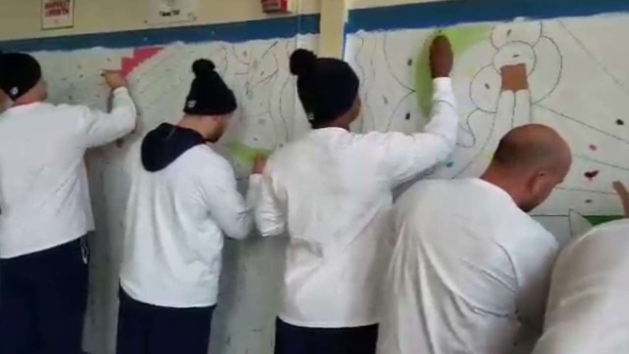 Sox prospects work with students to paint school mural
