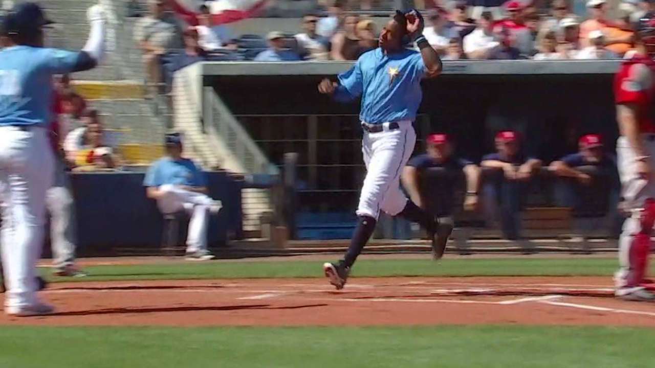 Sucre comes through with bat, behind plate