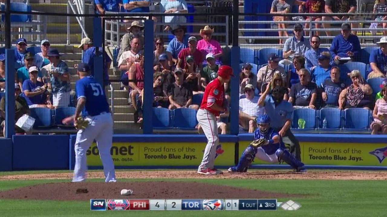 Latos strikes out Cozens