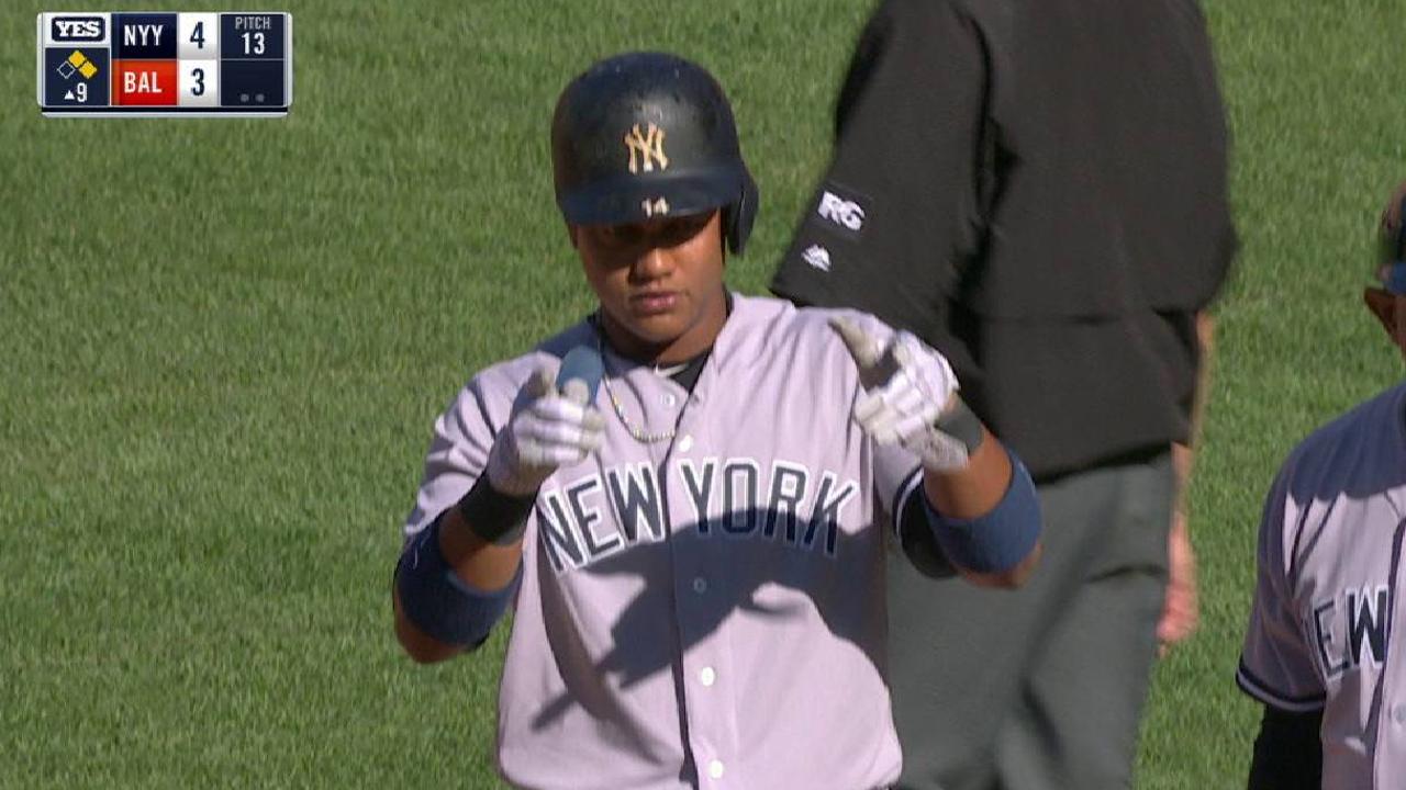 Yankees use 4-run 9th to deal O's first loss