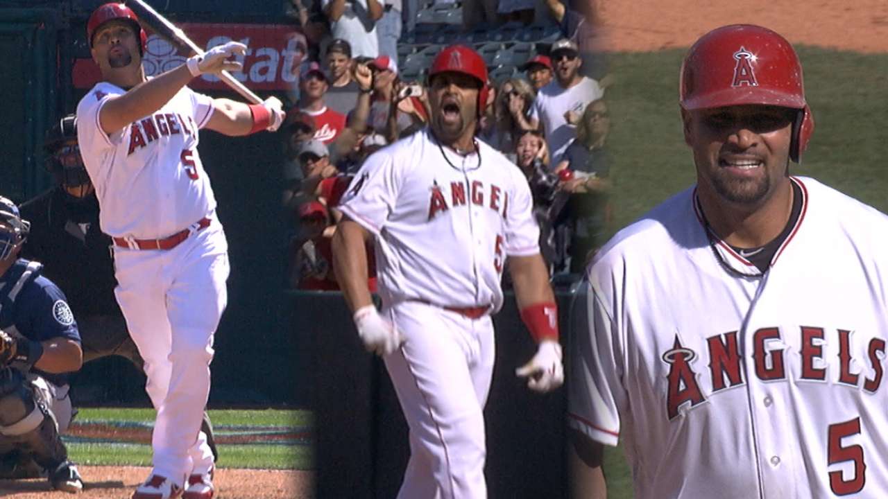 Angels score seven in ninth to stun Mariners