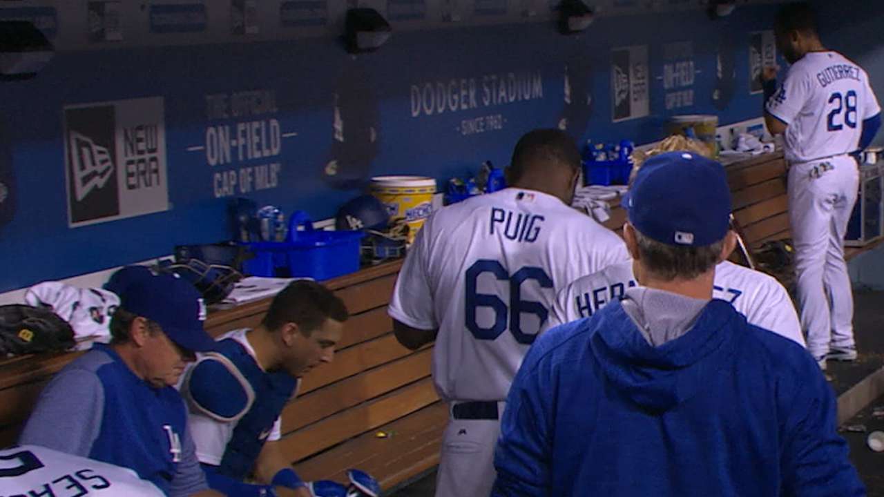 Puig exits vs. Marlins with back tightness