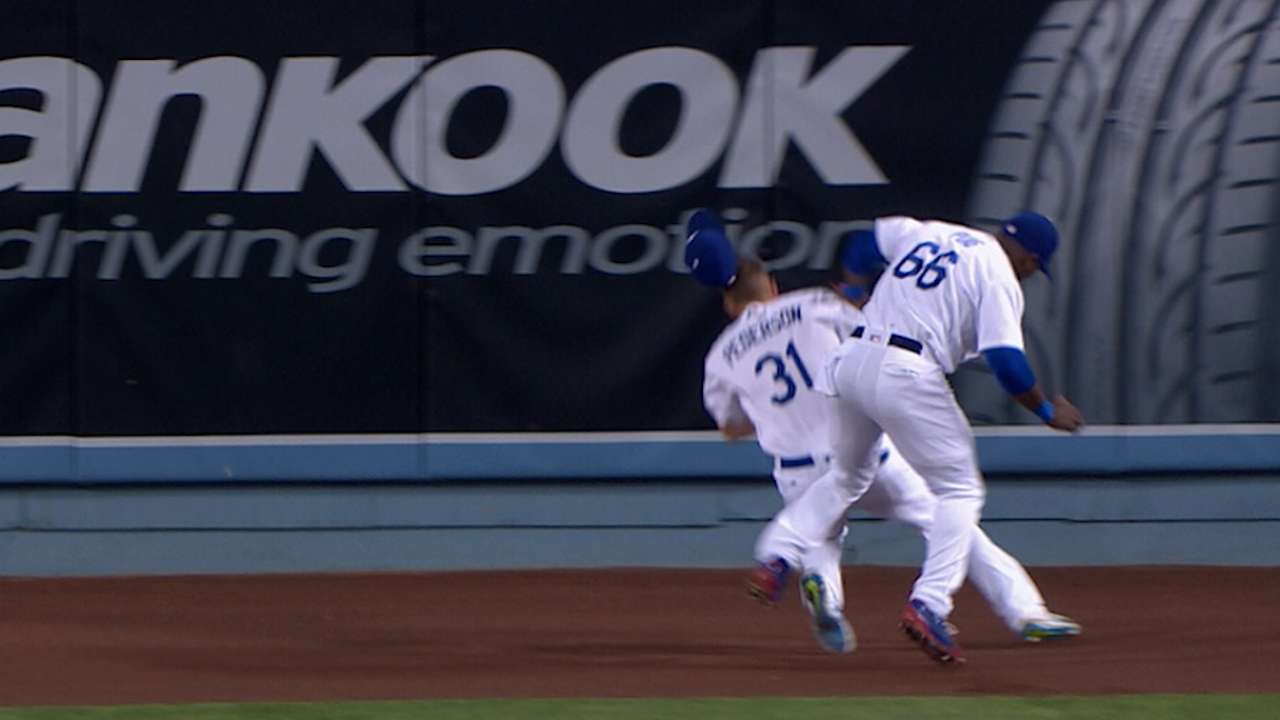 Puig, Pederson collide on catch