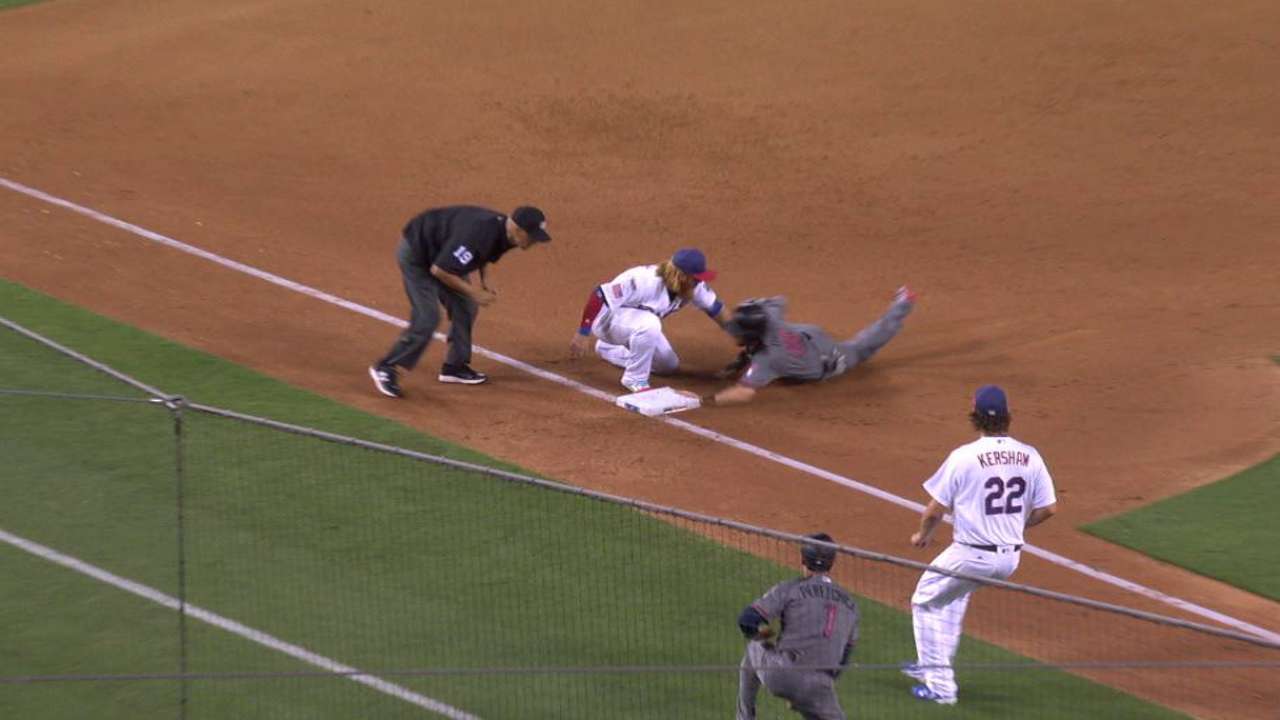 Owings' crafty slide at third