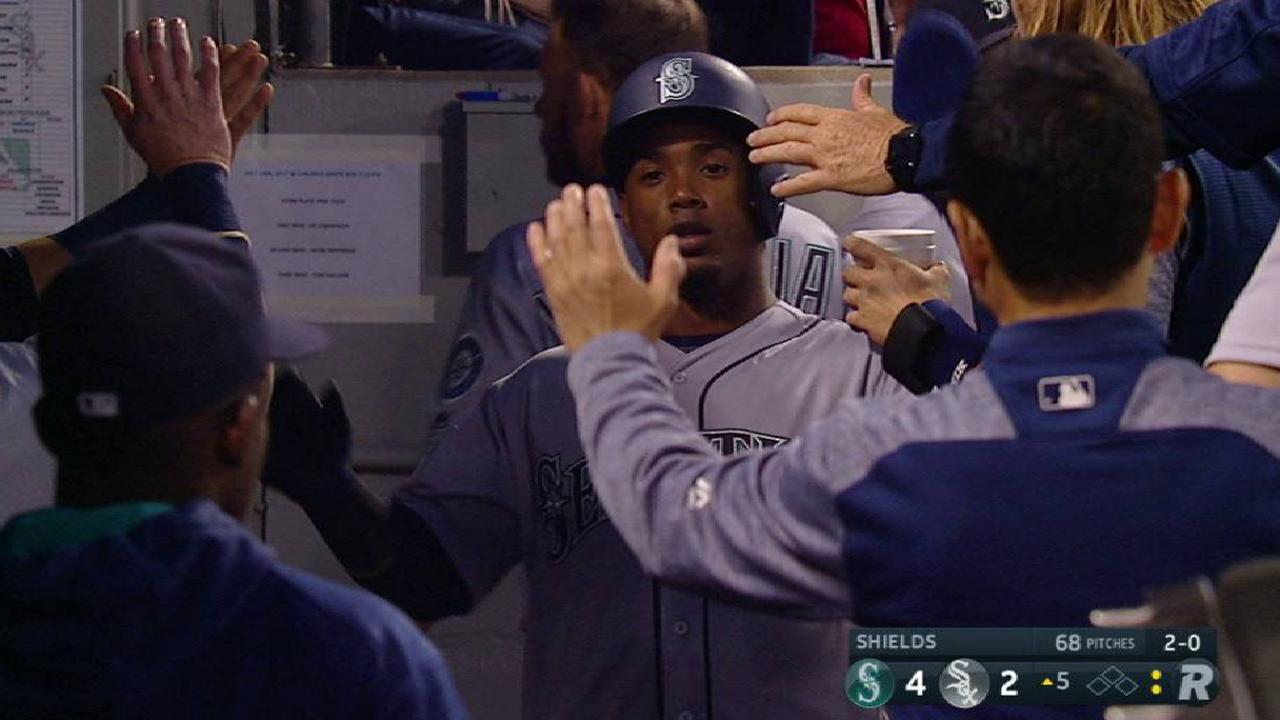 Segura scores on a wild pitch