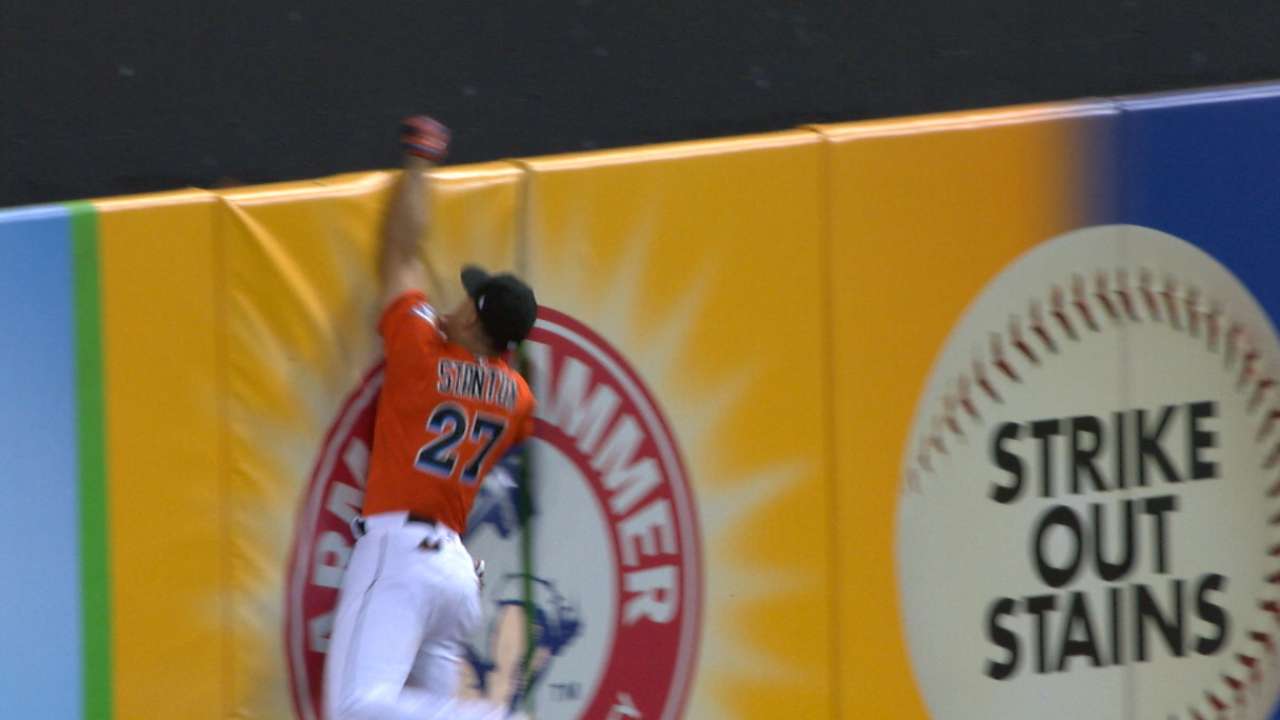 Stanton loses glove over wall