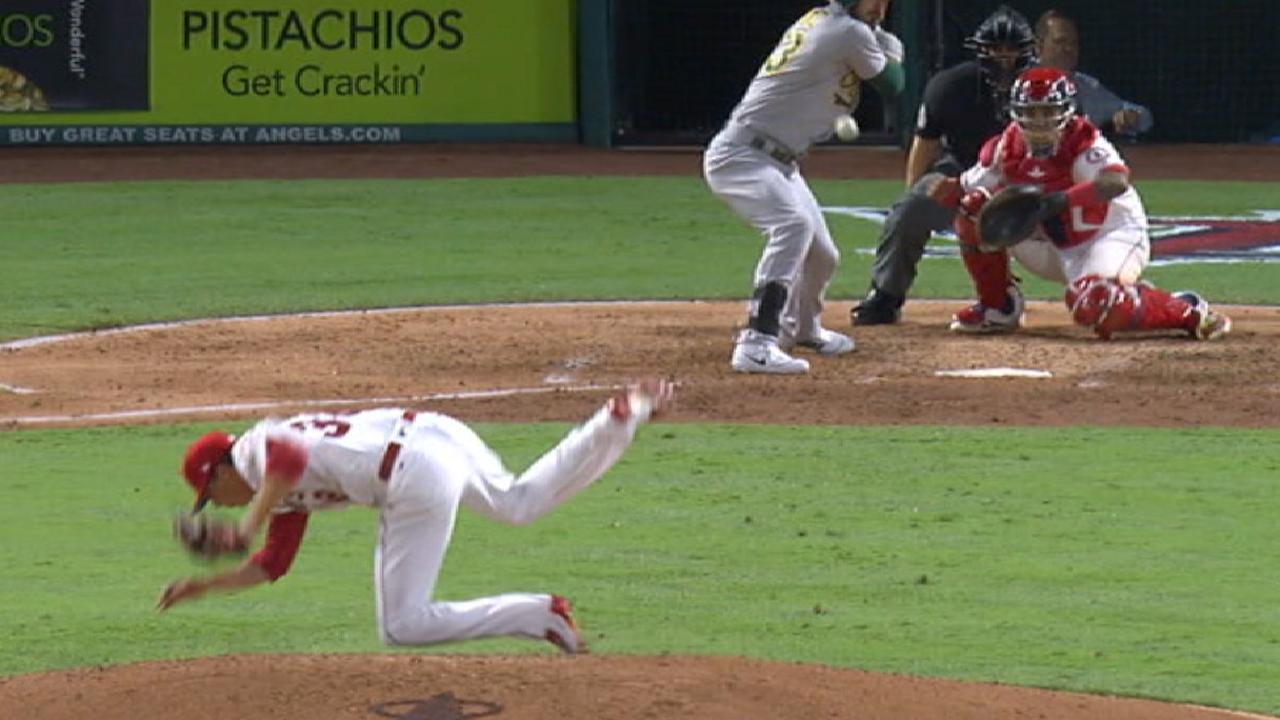 Scribner slips throwing a pitch
