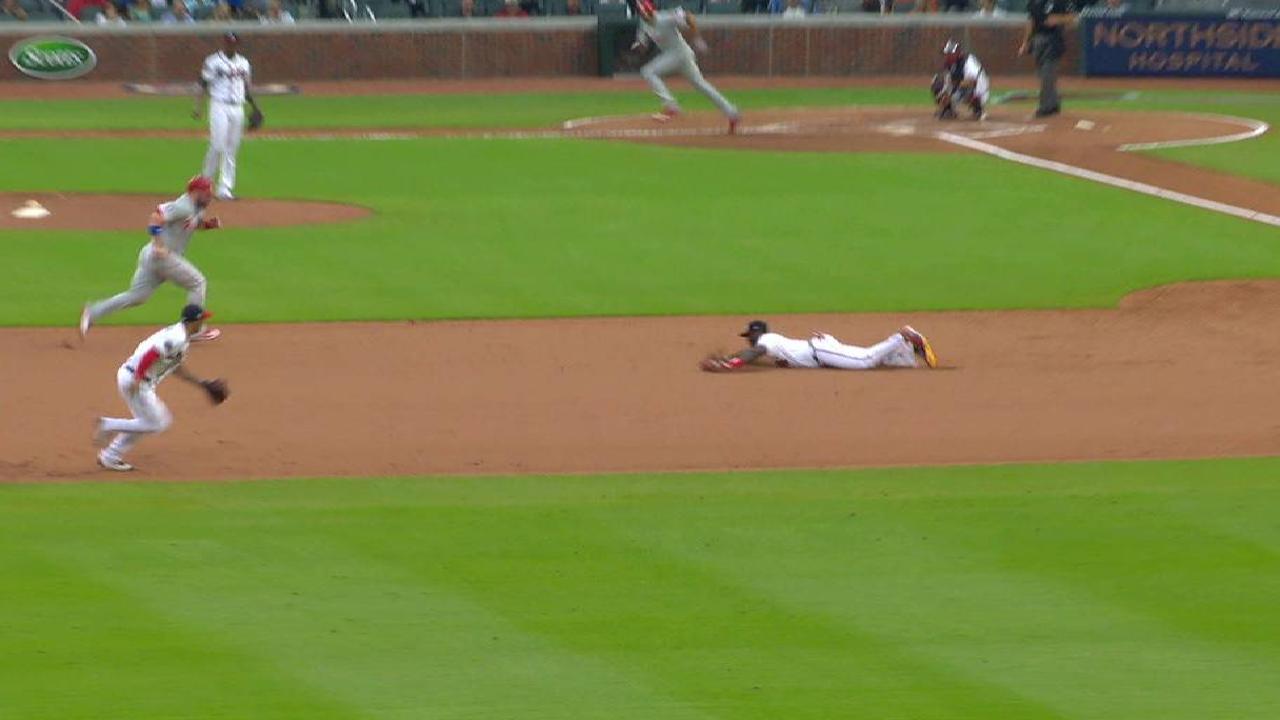 Phillips' diving play saves run