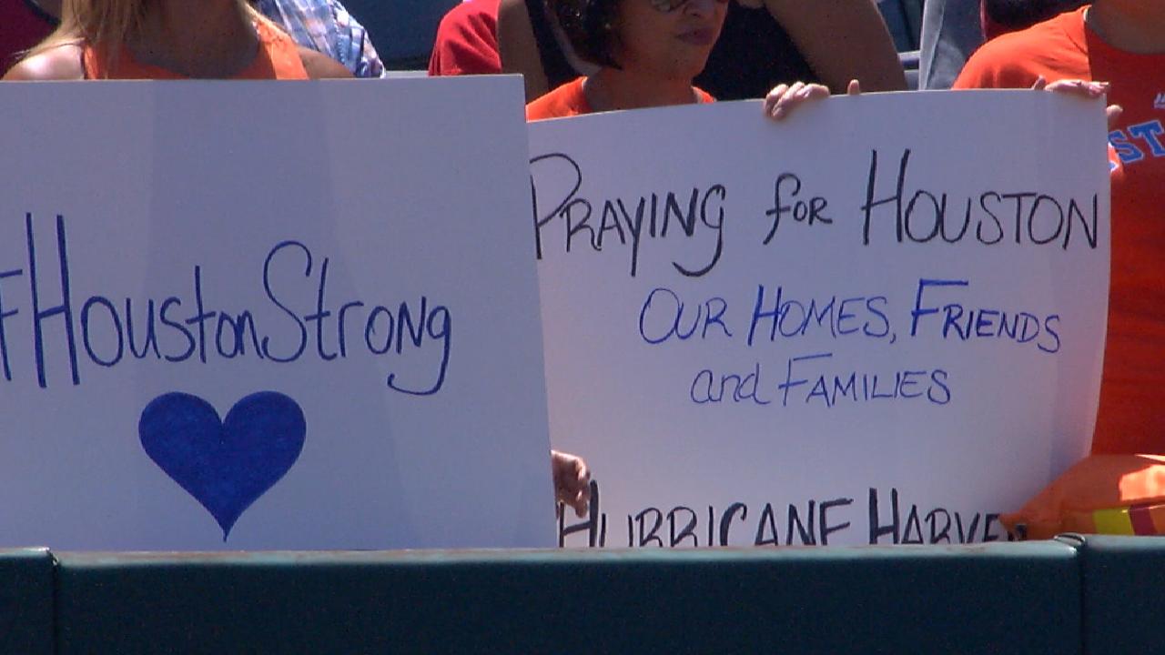 Fans make signs for Houston