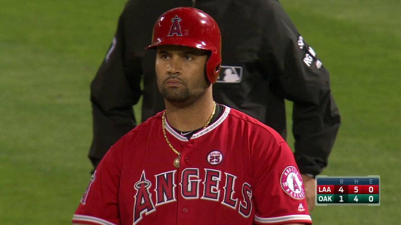 Pujols has bone bruise, cleared to play Friday