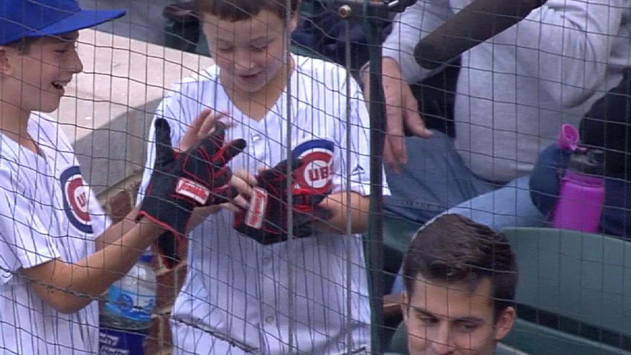 Votto gives his gloves to a fan