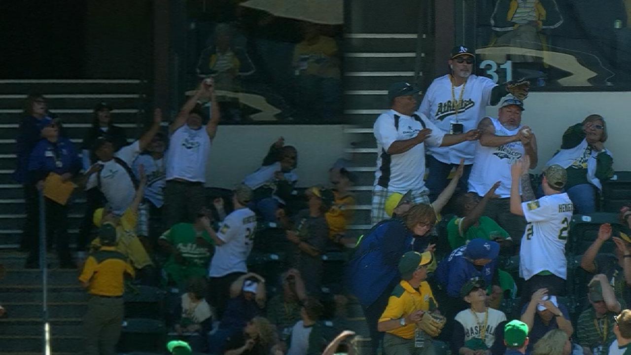 An Oakland A's fan caught foul balls on two consecutive pitches